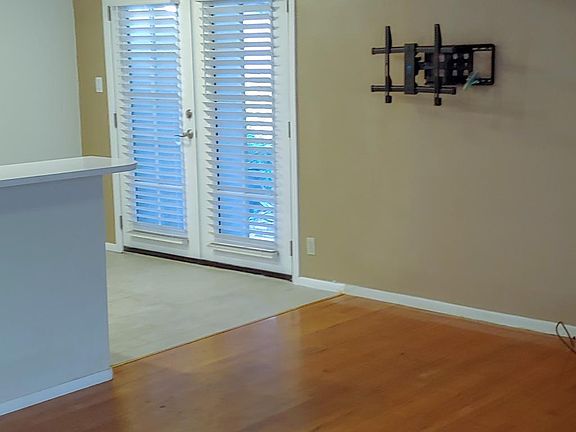 Living room has swivel TV mount so that you may watch in kitchen or living room.