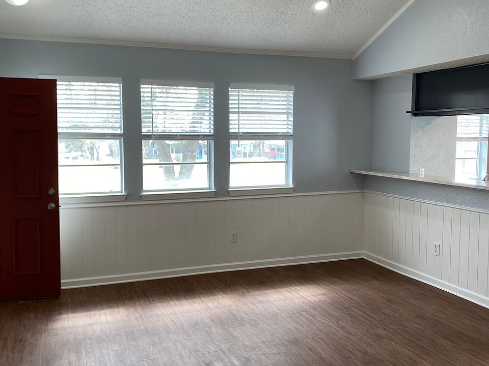 Living room with vaulted ceiling.