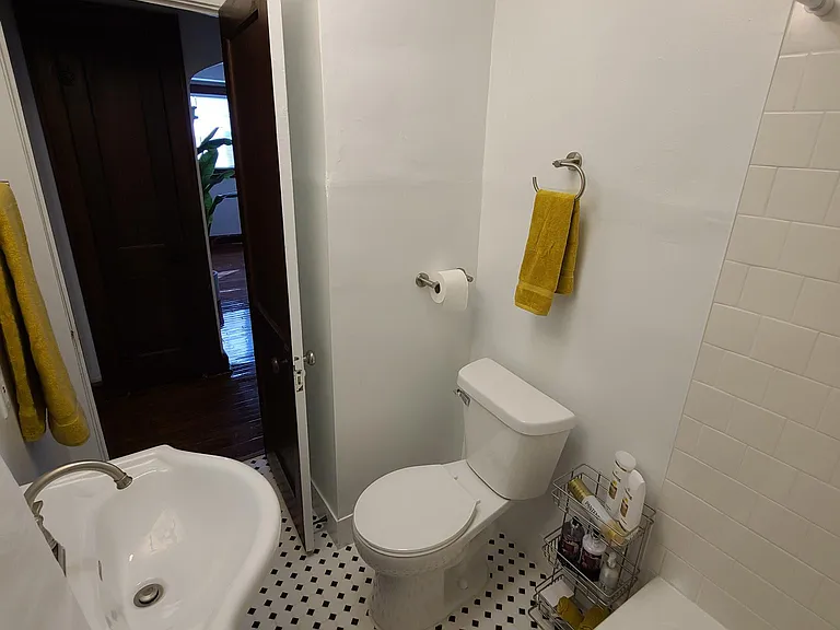 New Bathroom featuring Custom Tile Shower Walls and Flooring with brand new toilet, vanity, medicine cabinet, towel bars, and lighting