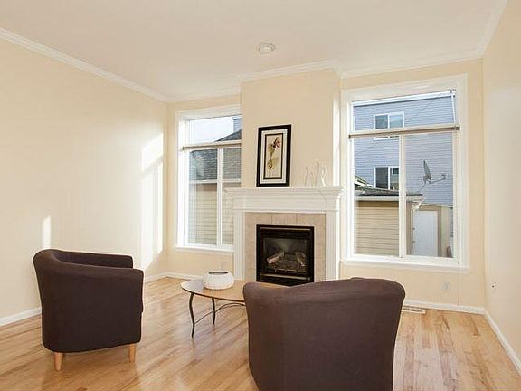 Nice and bright living room with cozy gas fireplace