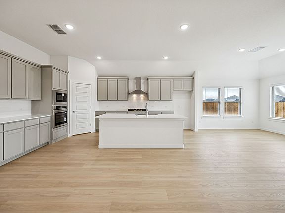 Kitchen in the Gilmour II home plan by Trophy Signature Homes - REPRESENTATIVE PHOTO