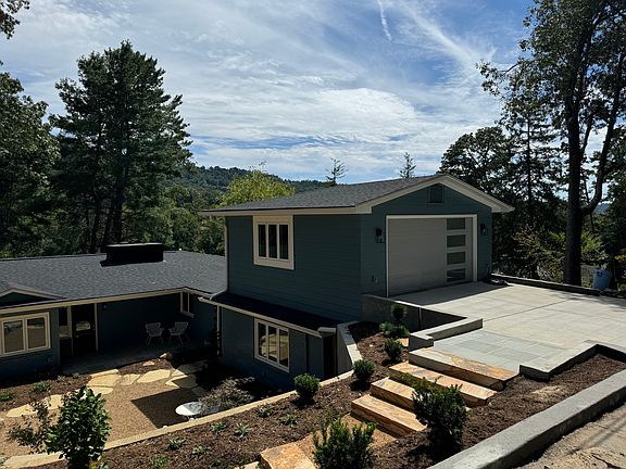 Garage with indoor parking and driveway parking