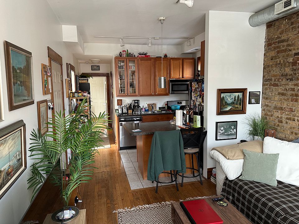 Living Room view from Bay Windows toward Kitchen/into apartment