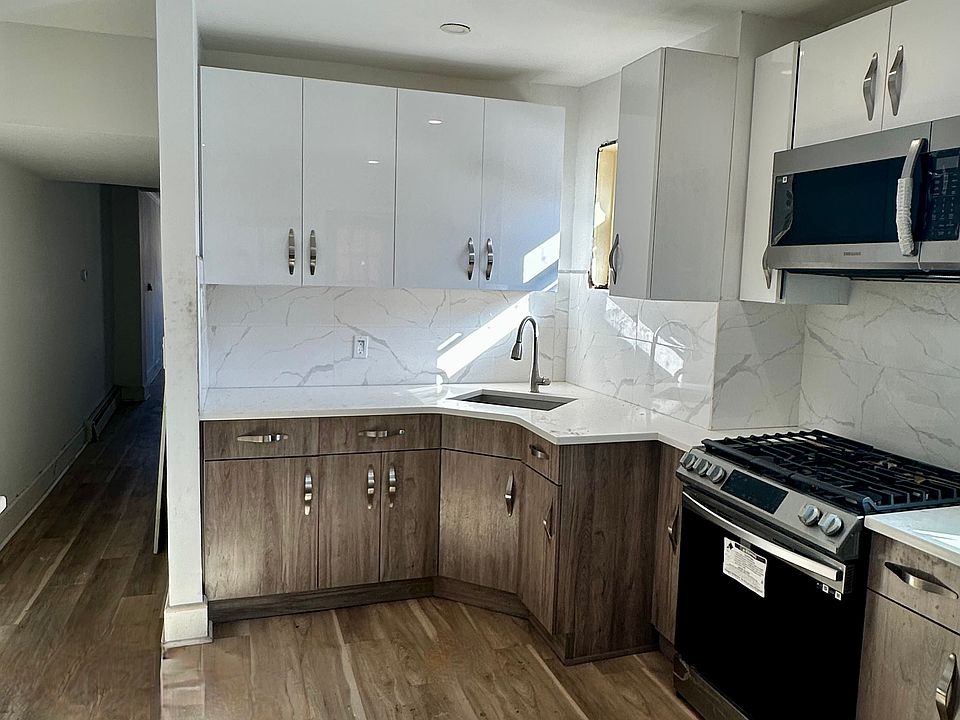 Freshly renovated kitchen, new stainless steel CORNER SINK, adjacent window for natural light.