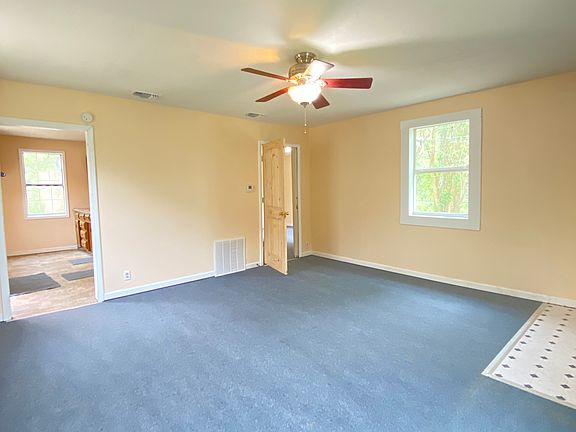 Another view of the living room looking back towards the kitchen and bedroom