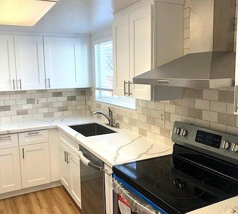 Newly remodeled kitchen with new appliances (tenant provides own refrigerator).
