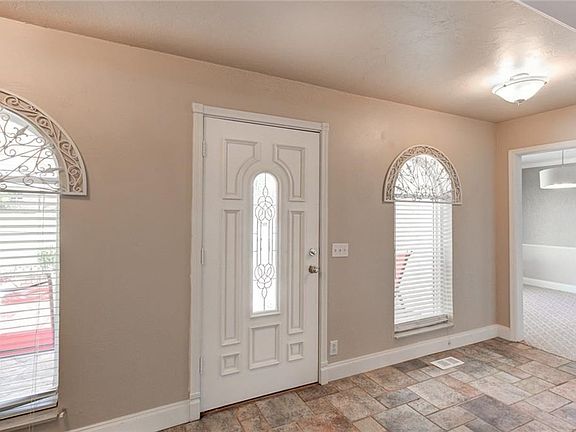 Entry foyer with view of formal dining to the right