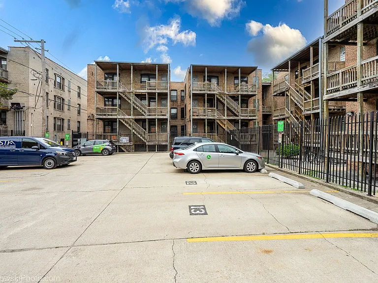 Back exterior of building where parking can be rented