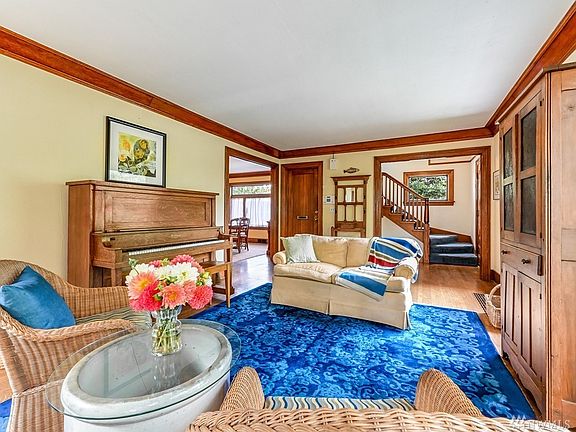 Living room with easy access to foyer, dining and kitchen makes it secluded without feeling cut off