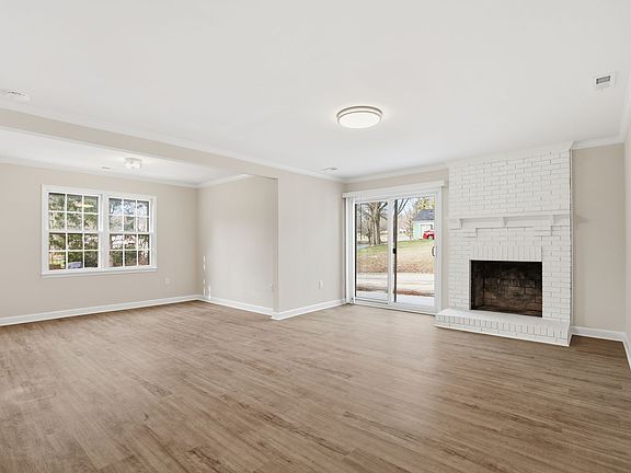 Huge Great room/Dining area with wood-burning fireplace.