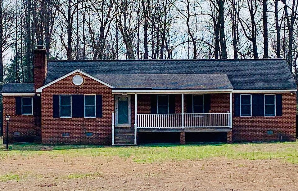Front Exterior view. Large front covered porch with porch swing anchors already installed