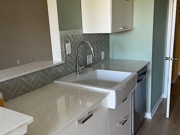 Farm sink, ikea drawers and cabinets in kitchen and bathroom