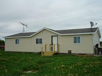 Updates include: Bathrooms redone, ceramic tile in kitchen, new plumbing, hot water heater & new well, siding, windows, insulation and new interior doors!