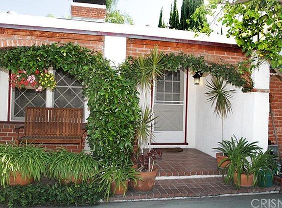 Front House Features Large Porch.