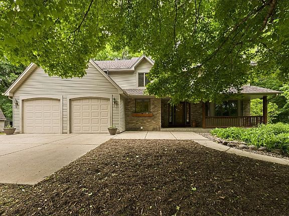 Large Front Porch, lots of gardens and concrete driveway