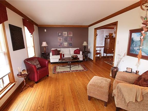 Spacious Living Room with newer hardwood floors.