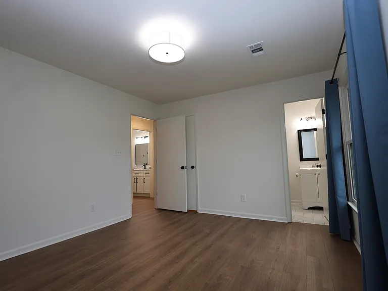 Master Bedroom with view to Master Bath and out to hallway and Main Bath