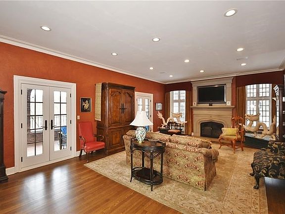 Gorgeous living room boasts new French doors leading to side porch.