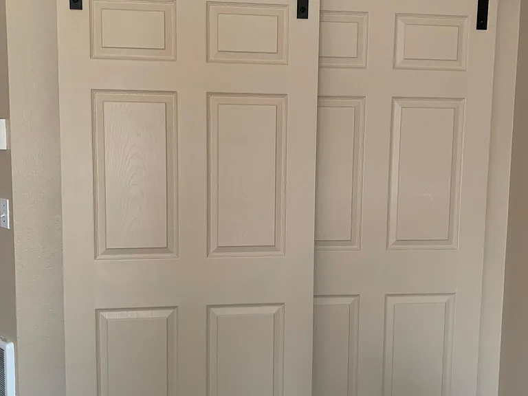 New barn door style closet install in downstairs bedrooms