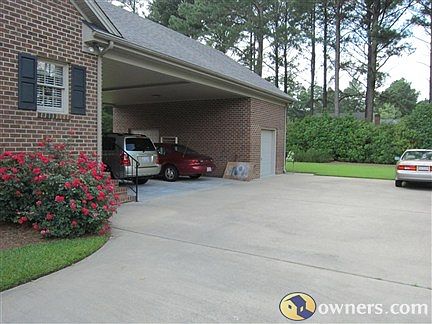 Large attached 2 car carport