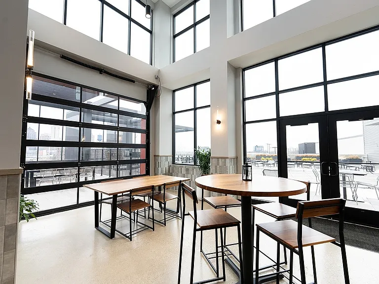 Embrace urban elegance in this bright, airy dining area designed for relaxation and entertainment.