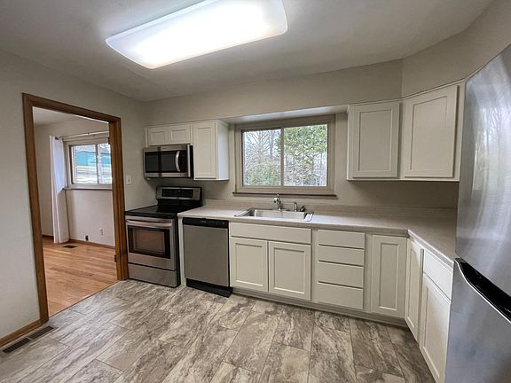New kitchen cabinets and flooring, adjoining dining room
