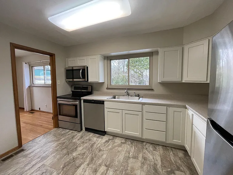 New kitchen cabinets and flooring, adjoining dining room