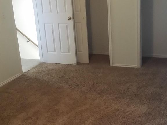 Master bed with his and her closets.