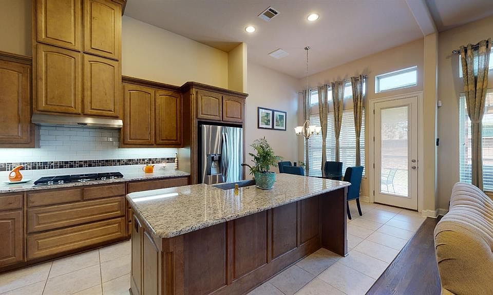 Kitchen/Dining: Stainless steel farm sink, granite counters, use of spice rack.