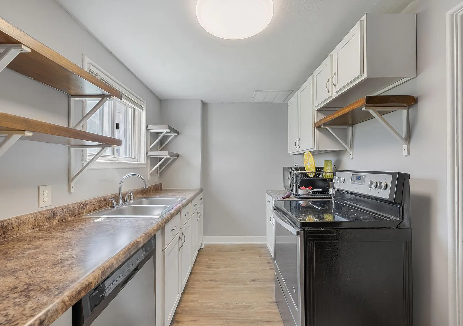 Home-Like Living with Sunroom, Attached Garage & In-Unit Laundry — Photo 4