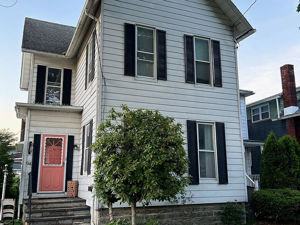 Front of house. Apartment entrance is to the right of the driveway, not the door shown.