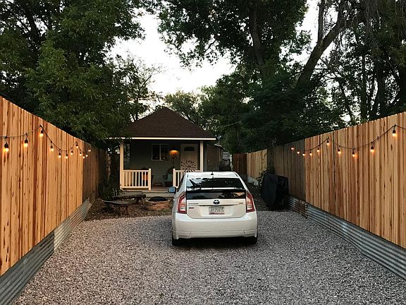 PRIVACY FENCING, GATED AND GRAVELED PARKING.
