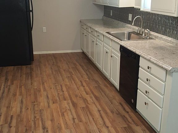 Extended kitchen area with lots of countertop space.