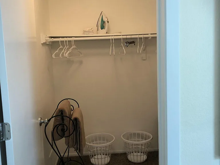 Walk-in closet in master bedroom.