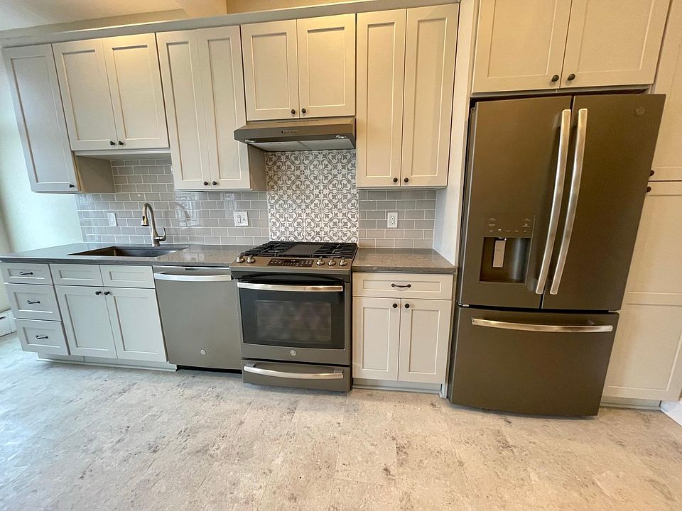New Kitchen w/ Stainless Appliances, Gas Range, Shaker Style Cabinets w/ Quarts Counters.