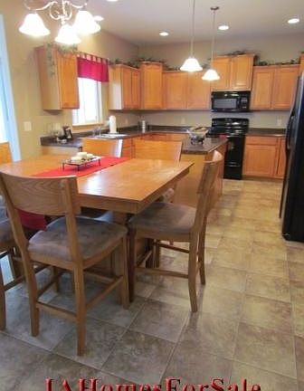 Large kitchen with custom cabinets.  Kitchen also features center island, 2 lazy susans, upgraded counter tops, recessed lighting, glass top stove, 9ft ceilings, and many other great features.