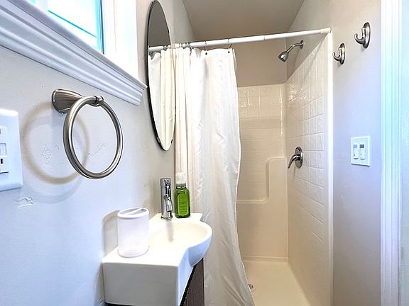 Private bathroom with shower, toilet & sink