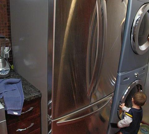 French door style refrigerator with bottom pull out freezer. Also a full-size washing machine and a full-size dryer for your convenience.