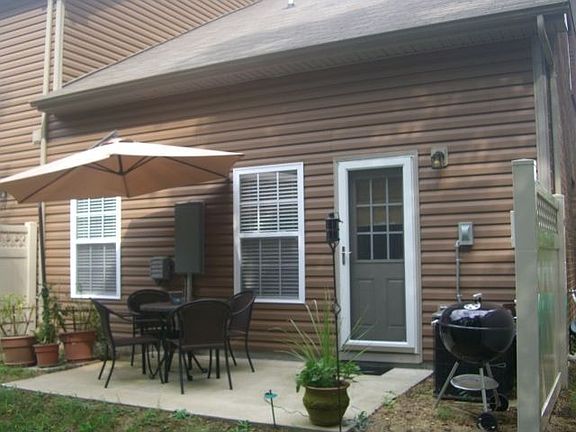 private patio looks into the heavily treed area