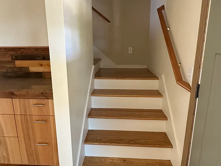 Stairs and landing to 2nd floor.