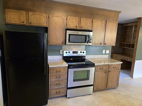 Refrigerator, microwave and stove 
Great counter and cabinet space