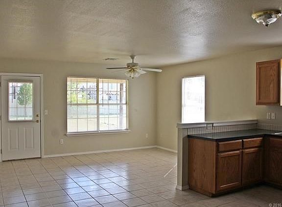 Open living room and kitchen. Not actual photo of property; photo of identical rental property.