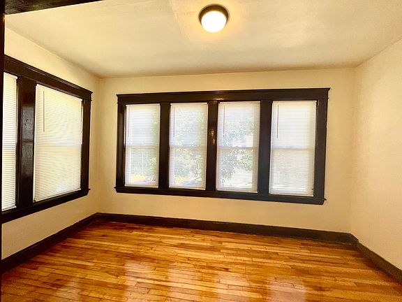 Bright sunroom overlooking front yard