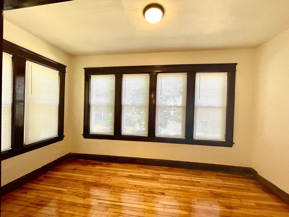 Bright sunroom overlooking front yard