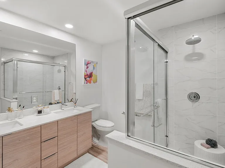 Modern bathrooms with ample storage.