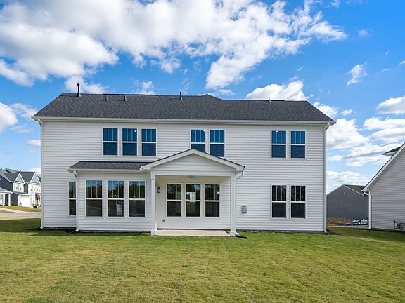 2 story single family home, all white with a 2 car garage