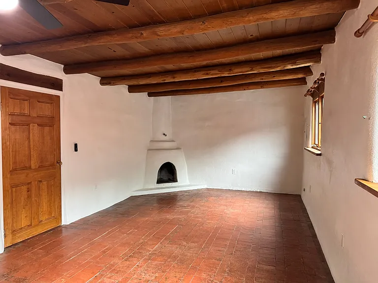 This is a photo of the bedroom of an adjacent unit with a similar layout to show the space without furniture.