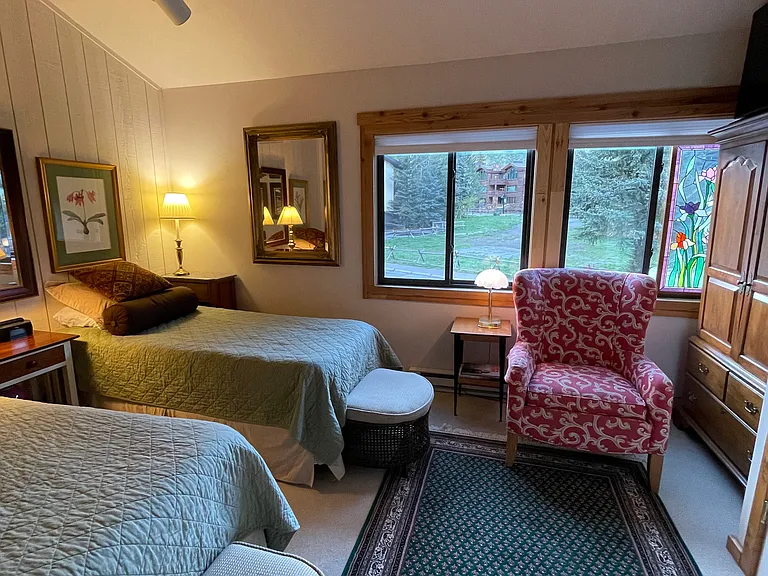 Guest bedroom with views of Warm Springs and the lodge.