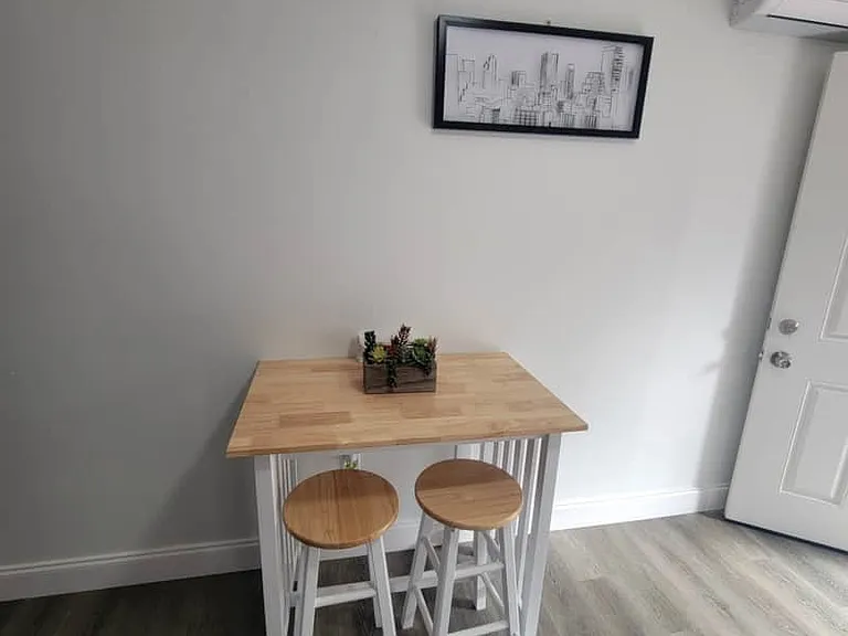 Dining area with a beautiful plant and decorative artwork