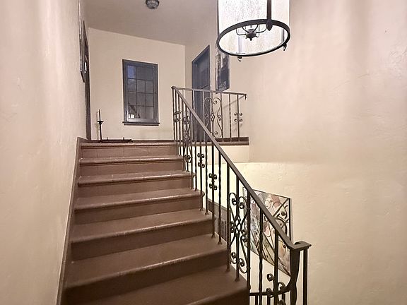 Stairway to landing of apartment 4 which is on the left.